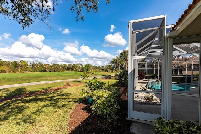 view of yard with a lanai