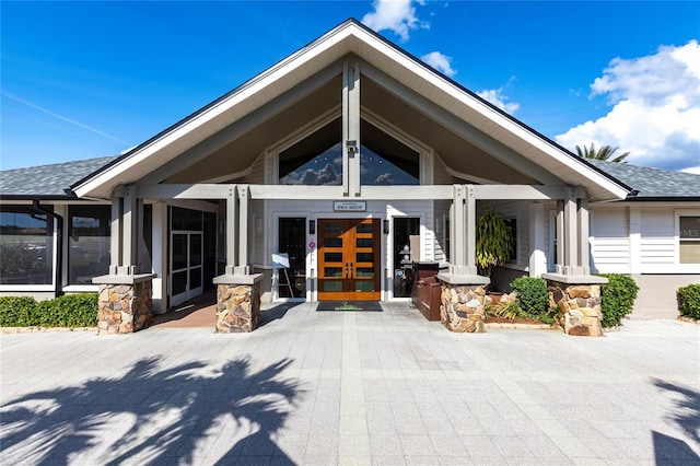 view of exterior entry featuring french doors