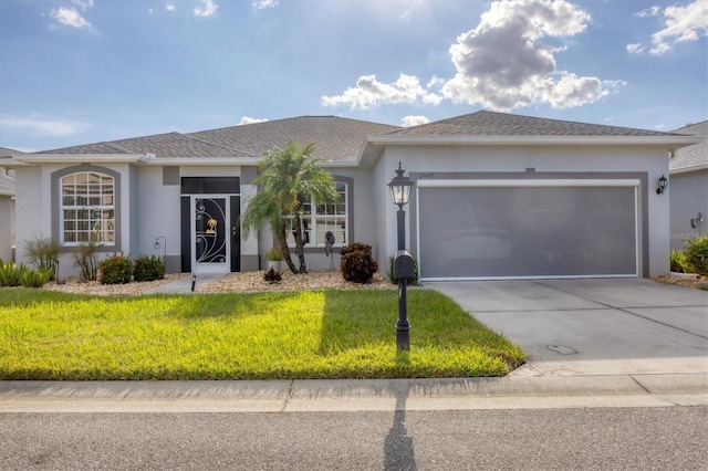 single story home featuring a front yard and a garage