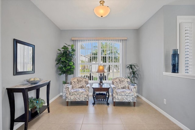 living area featuring light tile patterned flooring