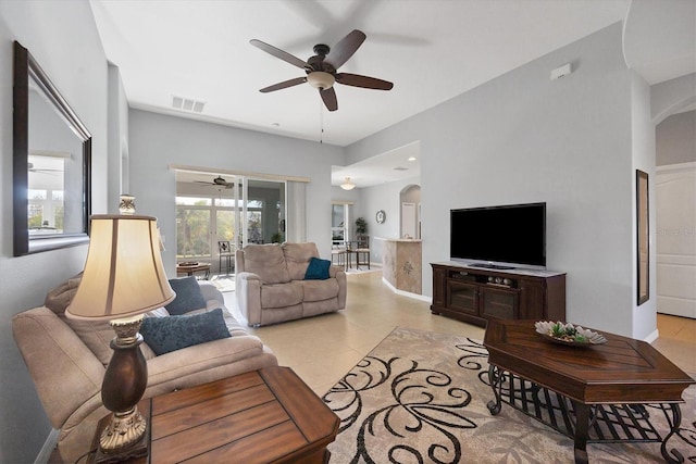 living room featuring ceiling fan and light tile patterned floors