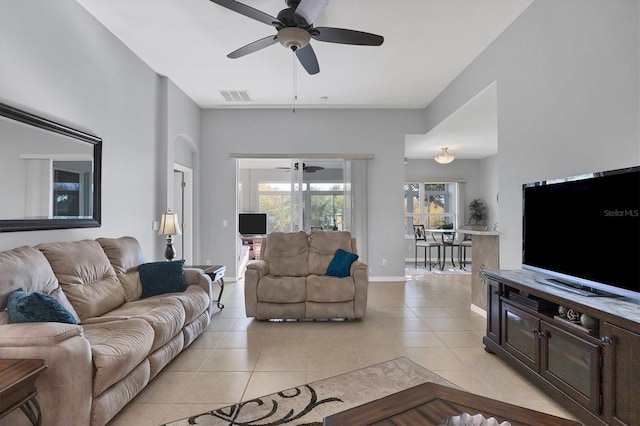 tiled living room featuring ceiling fan