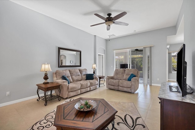 tiled living room featuring ceiling fan