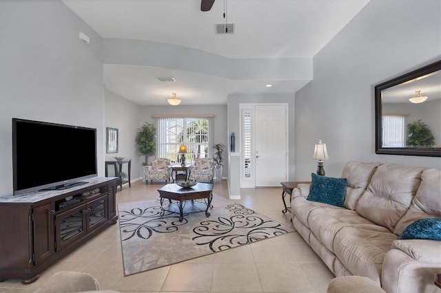 living room with ceiling fan and light tile patterned floors