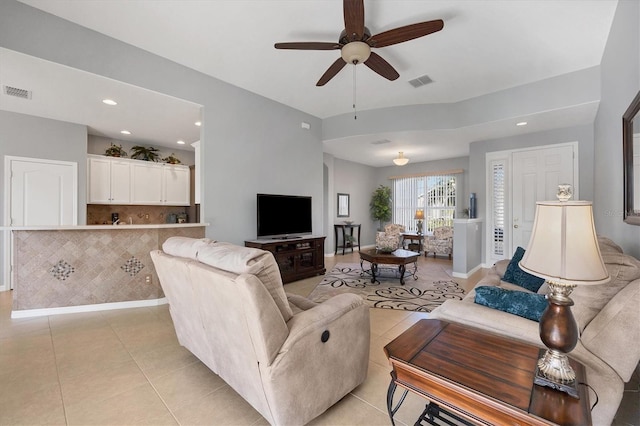 tiled living room featuring ceiling fan