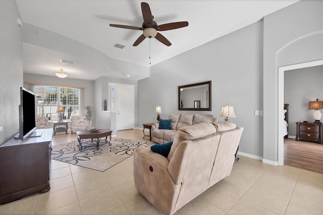 living room with ceiling fan and light tile patterned flooring