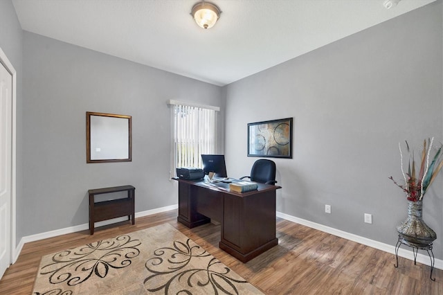 office area with hardwood / wood-style flooring