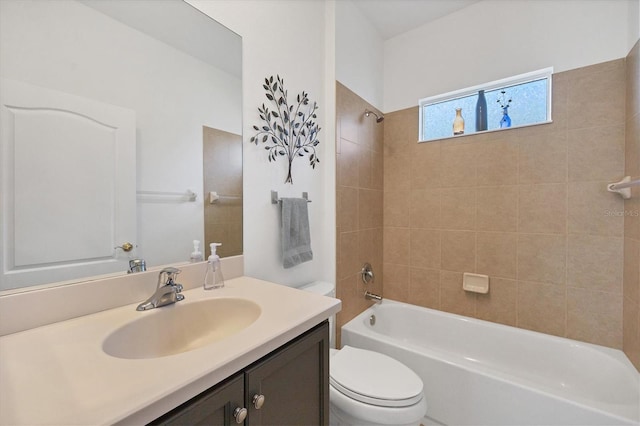 full bathroom with vanity, toilet, and tiled shower / bath combo