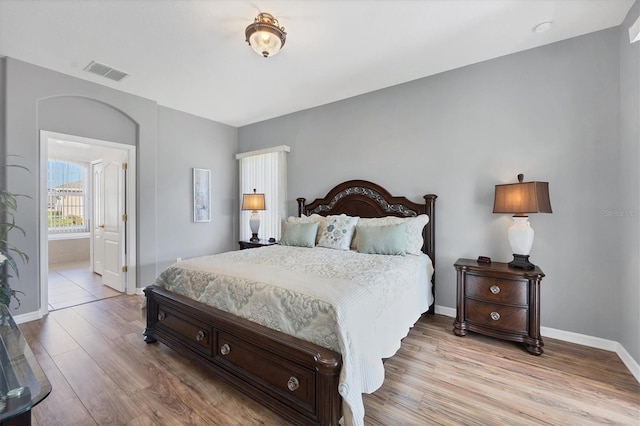 bedroom with light hardwood / wood-style floors