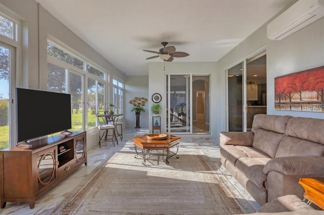 sunroom / solarium featuring a wall mounted air conditioner, plenty of natural light, and ceiling fan