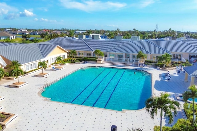 view of swimming pool featuring a patio area