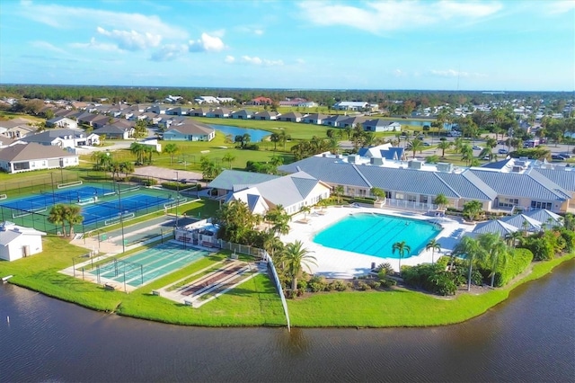 birds eye view of property with a water view