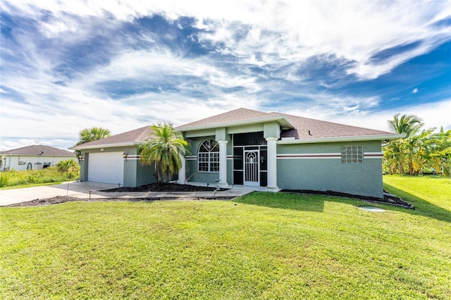 ranch-style home featuring a front lawn and a garage