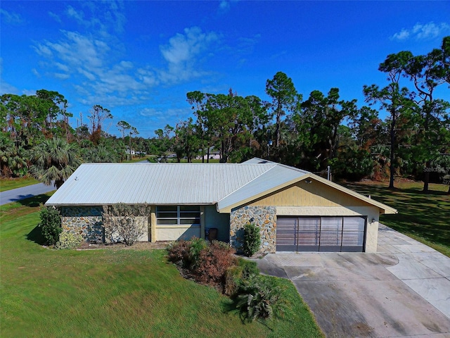 single story home with a front lawn and a garage