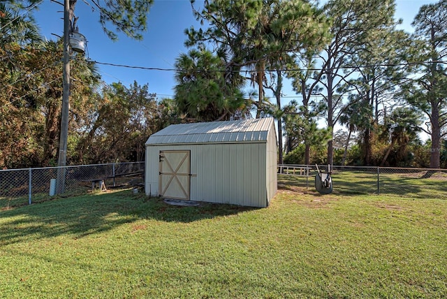 view of outbuilding with a lawn