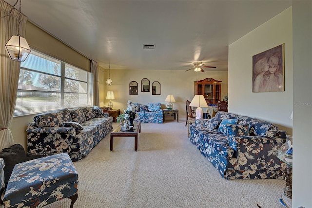 living room featuring ceiling fan and carpet flooring