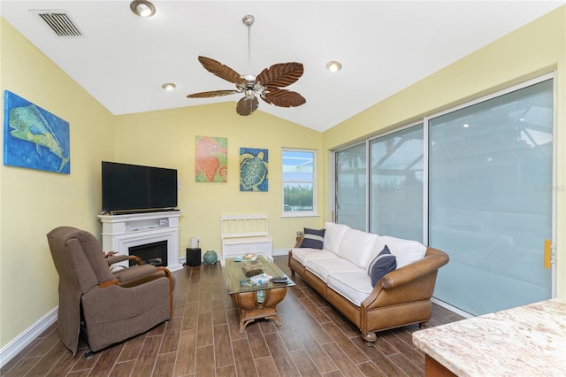 living room featuring ceiling fan, dark hardwood / wood-style flooring, and lofted ceiling