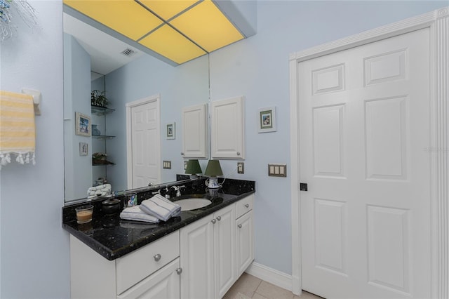 bathroom featuring tile patterned floors and vanity