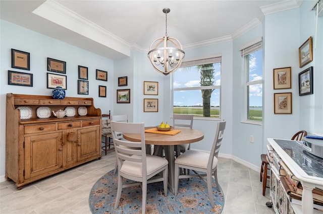 tiled dining room featuring ornamental molding and a chandelier