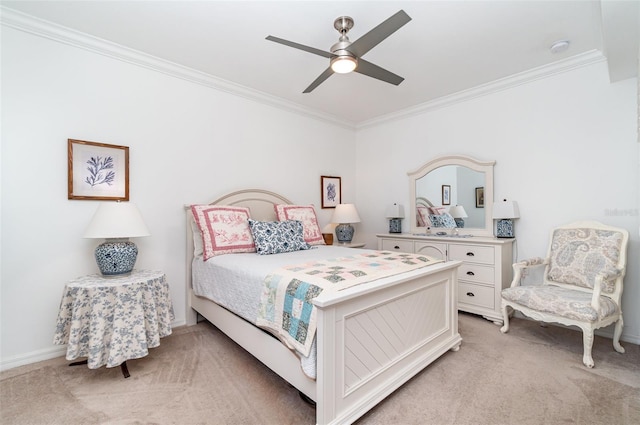 carpeted bedroom featuring ornamental molding and ceiling fan