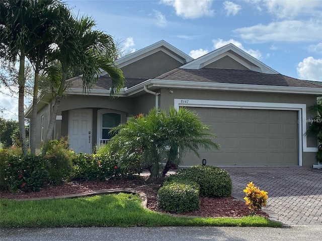 single story home featuring a garage