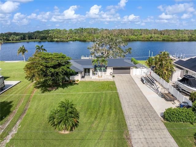 birds eye view of property with a water view