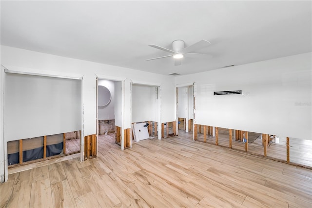 spare room with light hardwood / wood-style floors and ceiling fan