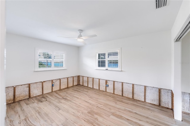 unfurnished room featuring light hardwood / wood-style flooring and ceiling fan