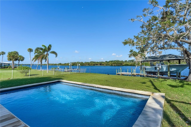 view of pool featuring a boat dock, a lawn, and a water view