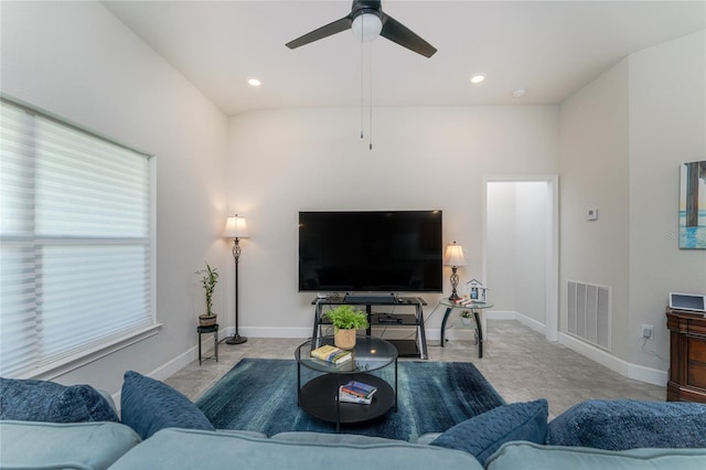 living room featuring lofted ceiling and ceiling fan