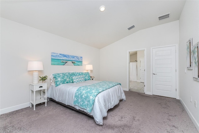 bedroom featuring carpet flooring and lofted ceiling