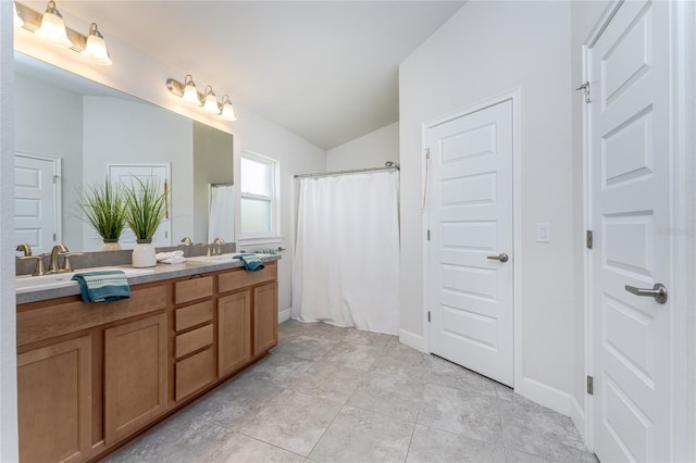 bathroom featuring vanity, a shower with curtain, lofted ceiling, and tile patterned floors