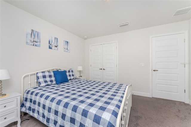 carpeted bedroom with a closet