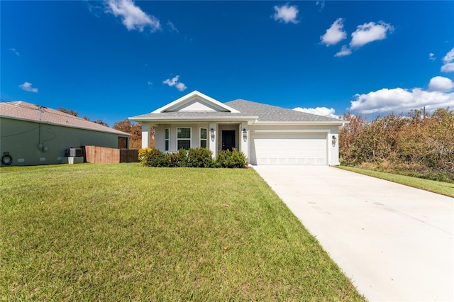 ranch-style home featuring a garage and a front lawn