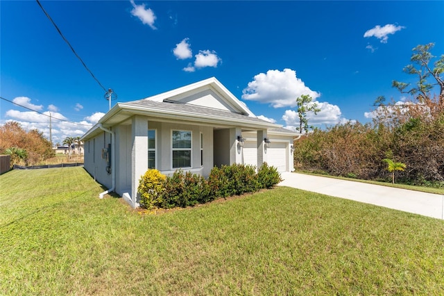 view of front of home featuring a front lawn and a garage