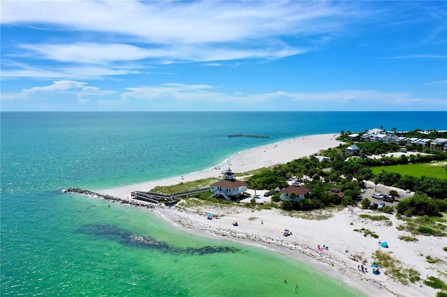 aerial view featuring a water view and a beach view