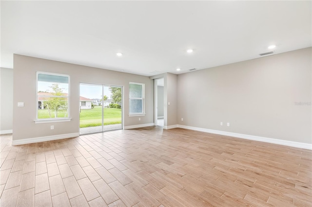 25236 Rampart Blvd, Punta Gorda, FL 33983 - spare room featuring light wood-style floors and recessed lighting