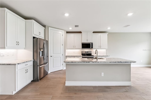 25236 Rampart Blvd, Punta Gorda, FL 33983 - kitchen with appliances with stainless steel finishes, tasteful backsplash, light wood finished floors, and recessed lighting