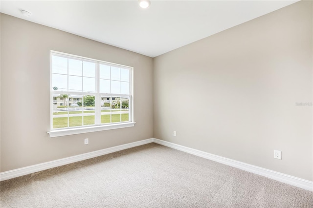 25236 Rampart Blvd, Punta Gorda, FL 33983 - unfurnished room featuring light carpet and a smoke detector