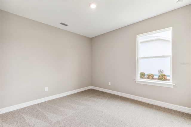 25236 Rampart Blvd, Punta Gorda, FL 33983 - spare room featuring carpet and a smoke detector