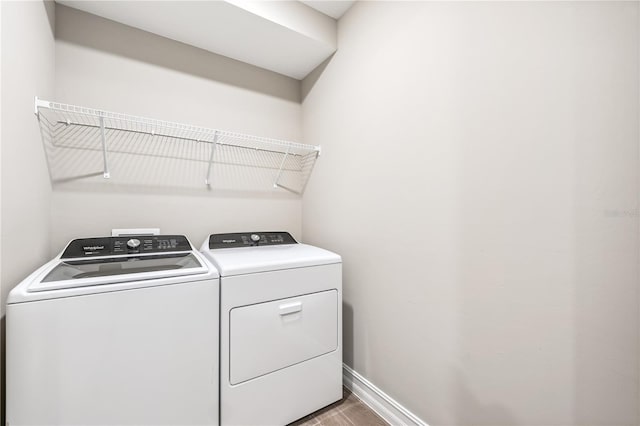 25236 Rampart Blvd, Punta Gorda, FL 33983 - laundry room with washer and clothes dryer and wood finished floors