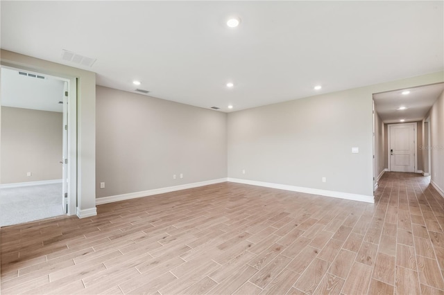 25236 Rampart Blvd, Punta Gorda, FL 33983 - empty room with light wood-style floors and recessed lighting