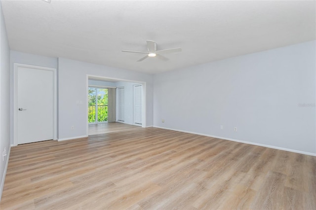 unfurnished room with ceiling fan and light wood-type flooring