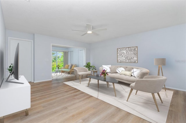 living room with ceiling fan and light wood-type flooring