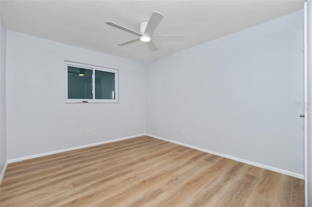 unfurnished room with ceiling fan and light hardwood / wood-style flooring