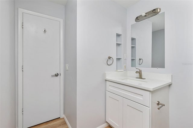 bathroom with vanity and hardwood / wood-style floors