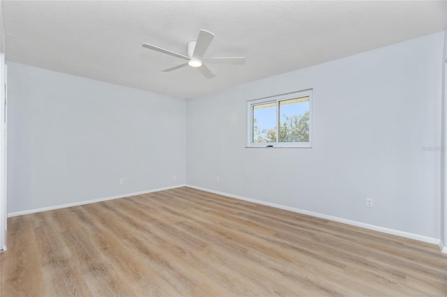 unfurnished room featuring light hardwood / wood-style floors and ceiling fan