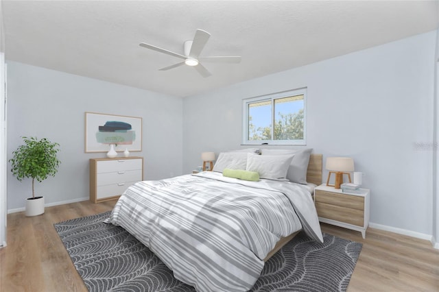 bedroom featuring light hardwood / wood-style floors and ceiling fan