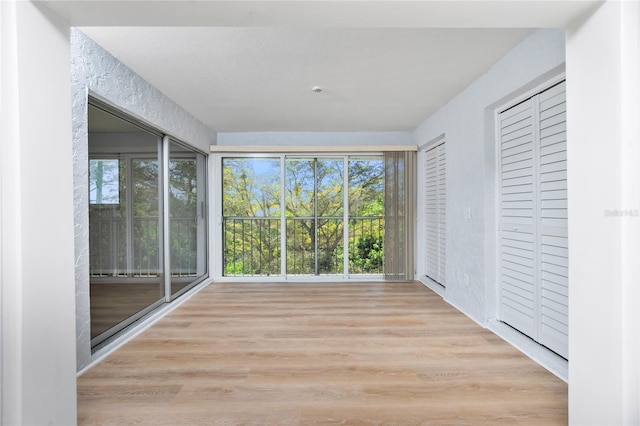 unfurnished sunroom featuring a healthy amount of sunlight