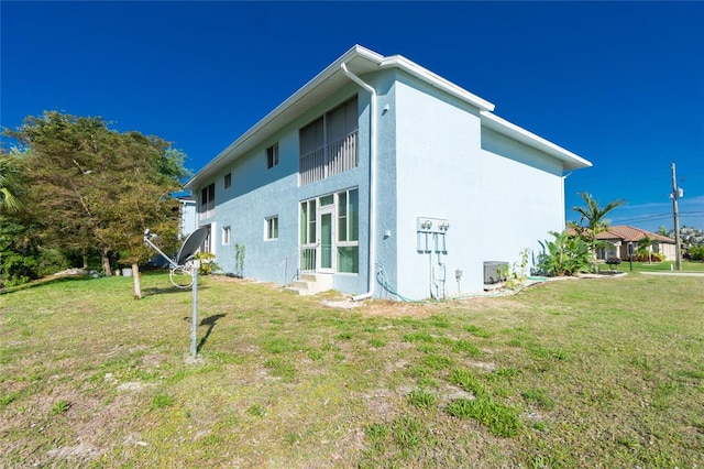 rear view of house with a lawn